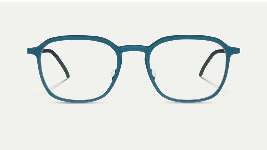 Vue de face d'une monture de lunettes géométrique carrée en métal bleu sarcelle mat avec des branches sombres, sur fond neutre clair.