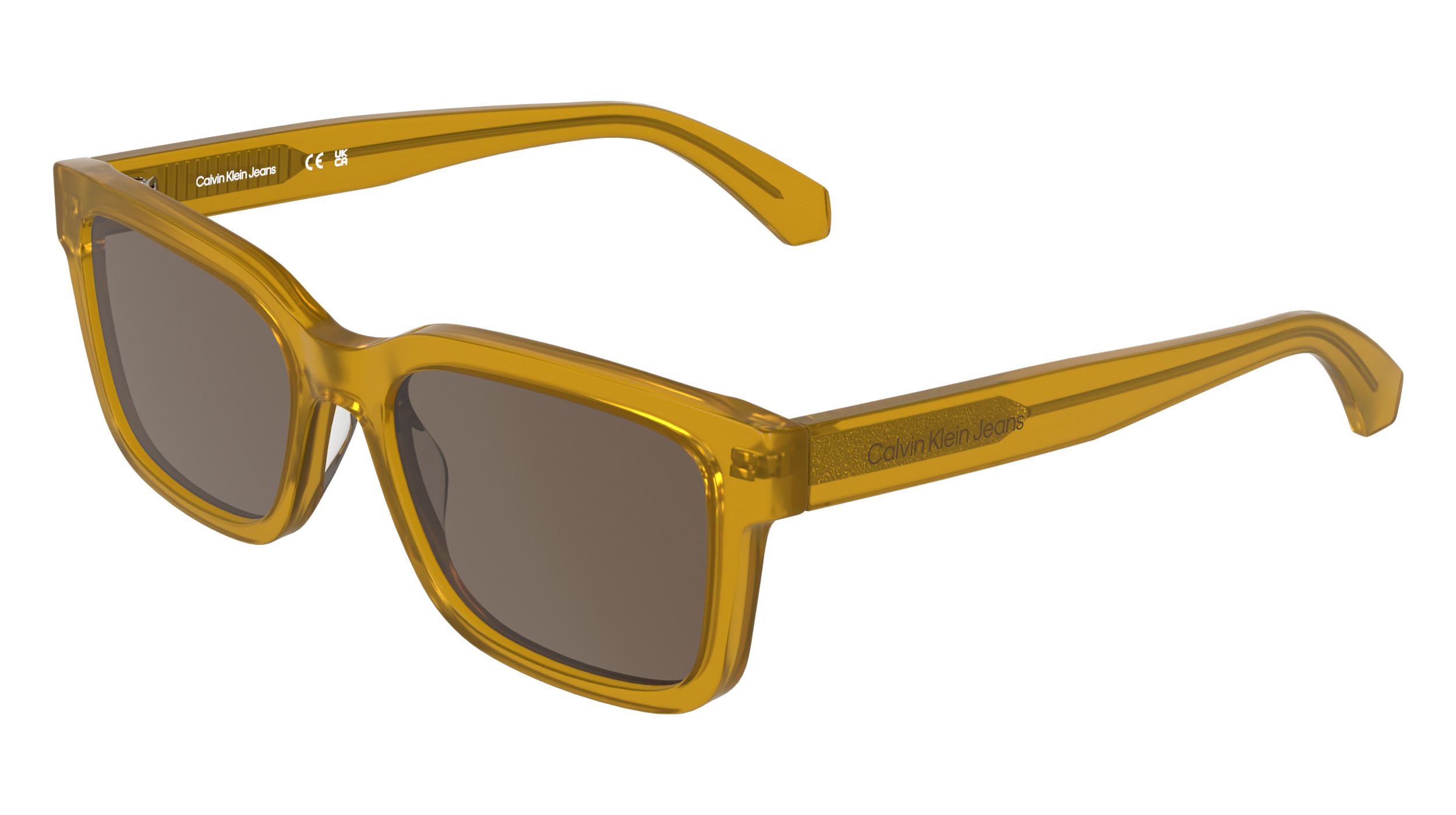 Lunettes de soleil Calvin Klein Jeans CKJ26300S dans le coloris Transparent Miel vers Brun, vue en trois quarts. Monture rectangulaire modifiée en ambre/miel chaud avec verres brun, branches dotées d'un fil métallique brillant apparent et du logo Calvin Klein Jeans, fabriquées en acétate Color Shift photosensible aux UV.