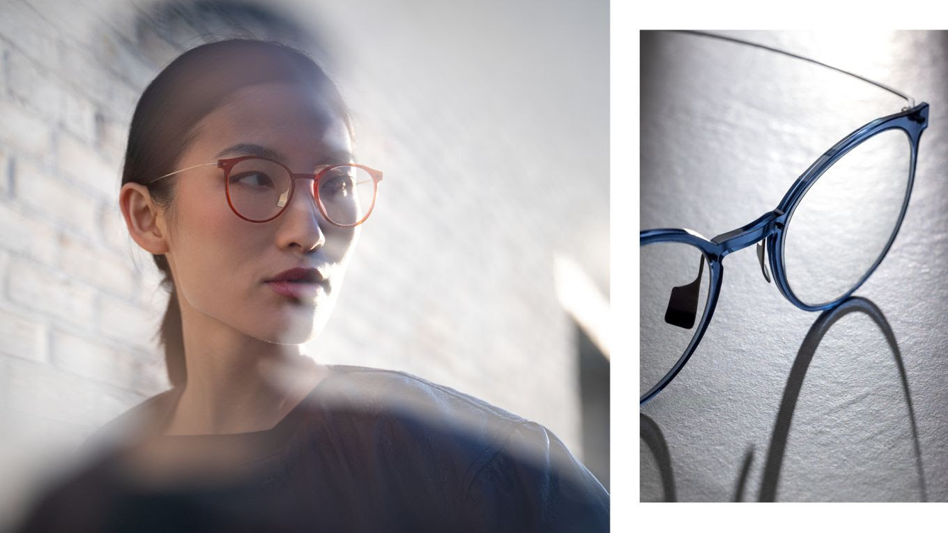 A woman wearing round red-brown Blackfin Vitra frames in warm backlight, alongside a close-up product shot of the same frame style in transparent blue, highlighting the VitraCore polymer front and titanium bridge construction.