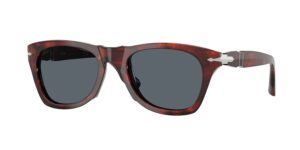 Front three-quarter view of Persol sunglasses in dark red marbled acetate with grey lenses and signature silver arrow hinge.