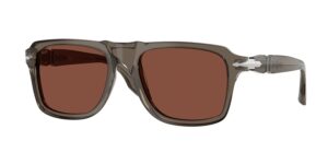 Three-quarter profile of Persol sunglasses with a transparent grey frame, brown lenses, and silver technical hinge details.