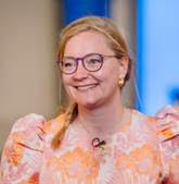 A close-up portrait of the contest winner, Marion Wolff, smiling at the EAOO 2026 conference.