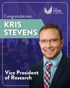 Promotional graphic from The Vision Council congratulating Kris Stevens on his appointment as Vice President of Research. The card features a headshot of Kris Stevens — a smiling man wearing glasses, a light blue dress shirt, and a plaid tie — against a purple background with a faded conference audience scene. The Vision Council logo appears in the upper right, and the text reads "Congratulations Kris Stevens, Vice President of Research.
