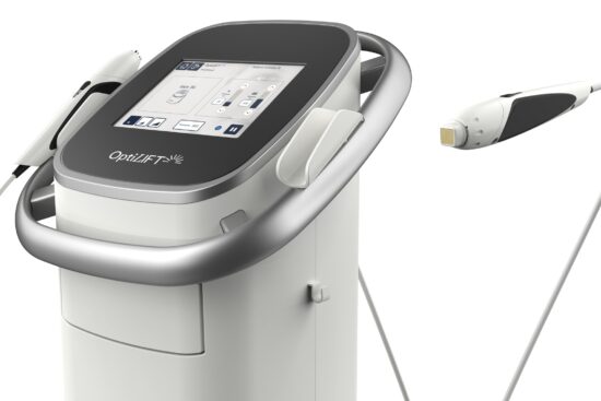 Close-up of the Lumenis OptiLIFT device console showing its touchscreen interface and control panel, with the DMSt handheld applicator and its gold-tipped treatment head displayed alongside.
