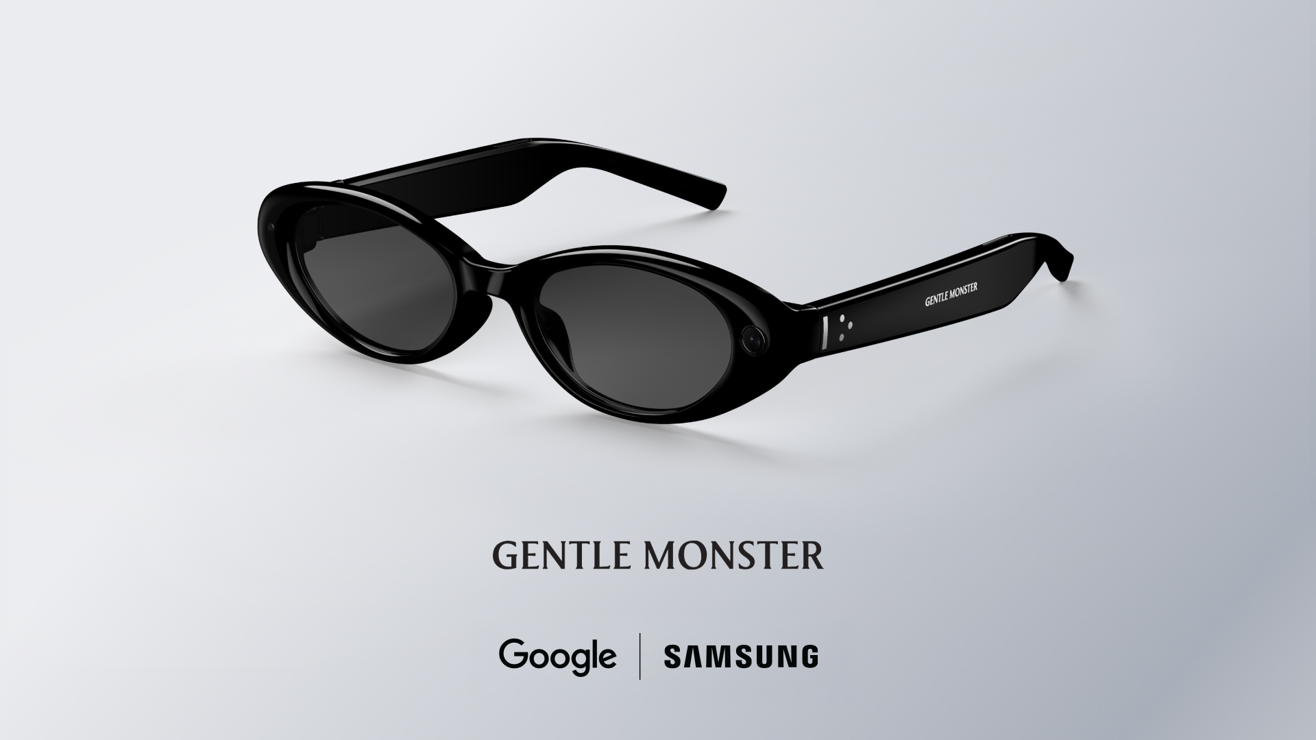 Lunettes intelligentes noires à monture ovale de Gentle Monster présentées dans un rendu studio, avec caméras intégrées et fonctionnalités d’IA développées en partenariat avec Google et Samsung.