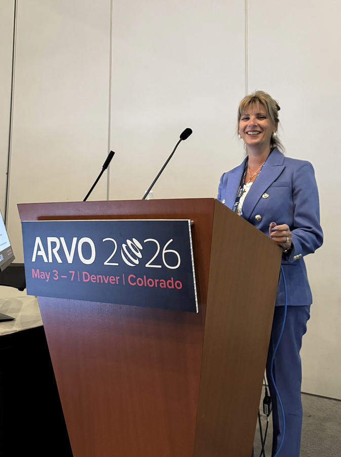 Speaker presenting at the ARVO 2026 Annual Meeting podium in Denver, Colorado