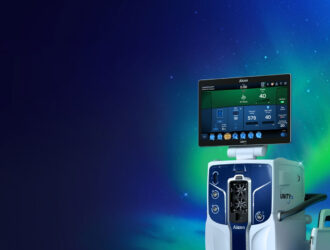 Alcon UNITY CS cataract surgical system — a next-generation standalone platform featuring a large touchscreen interface displaying surgical parameters including IOP, vacuum, aspiration flow, and 4D Phaco mode, mounted on a blue and white console, shown against a deep blue background with green aurora-like lighting.