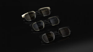 Alternate view of three luxury Blackfin Prometheus sunglasses showcasing the gold, ruthenium, and palladium-rimmed limited edition frames on a dark surface.