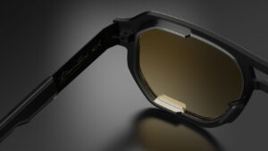 Close-up of the inner temple arm of a Blackfin Prometheus frame, showing the laser-engraved "Prometheus Two | Limited Edit" gold signature and a tinted lens