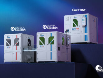 Three large, industrial MEI CoreTBA-series block-less lens production machines (OMEGA CoreTBA, ALPHA CoreTBA, and CoreTBA) are displayed on blue tiered platforms against a dark gradient background. Each machine is white, labeled with its name and the MEI logo, and shows varying sizes and features like screens and access points.