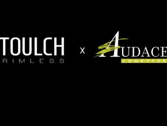 Graphic showing the Toulch Rimless logo next to the Audace Lunettes logo on a dark background, highlighting the distribution partnership of Canadian innovative eyewear.