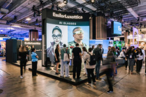 Crowds gathered around the main EssilorLuxottica AI Glasses exhibition stand at the VivaTech technology event in Paris.