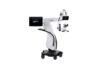 The Alcon UNITY M ophthalmic surgical microscope system, featuring a white mobile wheeled floor stand, an articulated boom arm, dual digital display screens showing the "UNITY M" logo, and a binocular optical head.