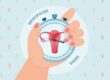 Illustration of a hand holding a blue stopwatch against a light blue background patterned with female gender symbols. Inside the stopwatch, a red uterus is displayed with clock hands pointing to it, flanked by the words "MENOPAUSE" and "SIGNS."