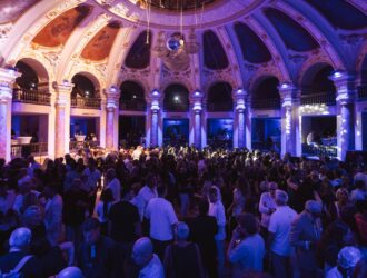 Large crowd gathered inside the illuminated Salone Margherita in Naples for the DaTE 2026 eyewear event.