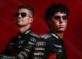 Audi Revolut F1 Team drivers Nico Hülkenberg and Gabriel Bortoleto wearing ic! berlin sunglasses against a dark red background.
