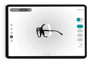 Fittingbox Optical Fit Pro 3D lens thickness simulation and refractive index comparison tool on a digital tablet interface