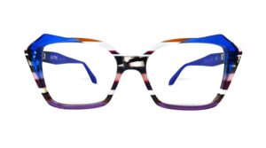 Front view of Ultra Limited GORIZIA angular cat-eye eyeglasses with a bold blue top brow line, sharp geometric outer edges, and horizontal striped acetate layers along the sides and lower frame.