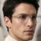 Man wearing LOOK NIL-TECH 75400 lightweight clear transparent rectangular eyeglasses with titanium temples.