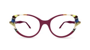 Front view of Ultra Limited MARATEA oval eyeglasses in a deep burgundy hue with subtle multi-colored striped acetate accents along the top brow and side temples.