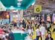 Crowded exhibition hall and brand booths at SILMO Paris optical trade show