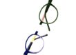 Top-down close-up of two round TREE Spectacles eyewear frames in green and blue, highlighting subtle graphic details and wave accents on the temple tips.