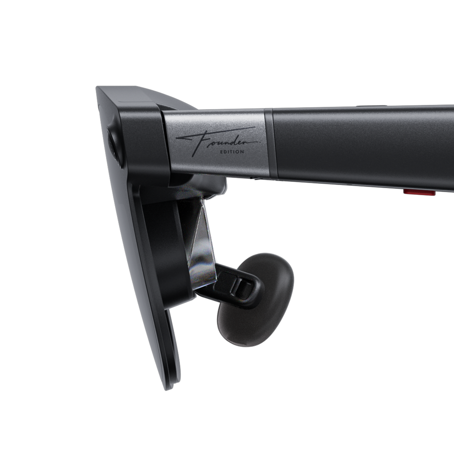 Close-up side view of the XREAL AURA Founder Edition frame hinge showing engraved branding and optical lens prism.