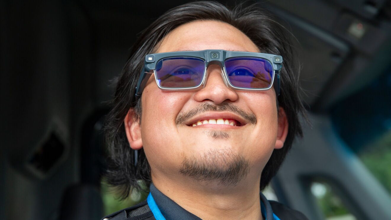 Amazon delivery driver wearing AI-powered smart glasses designed to assist with package navigation and last-mile deliveries.